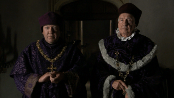 Bishop Cuthbert Tunstall [right] confronts Katherine of Aragon in "The Tudors".